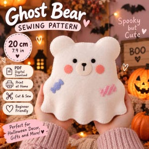May include: A white felt ghost bear sewing pattern featuring a 20 cm or 7.9 in size, black eyes, a nose, pink cheeks, and two candy appliques. The text reads Ghost Bear Sewing Pattern, Spooky but Cute, PDF Digital Download, Print at Home, Cut & Sew, Beginner Friendly, and Perfect for Halloween Decor, Gifts and More.