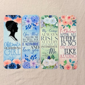 May include: Four colorful bookmarks with floral designs and inspirational quotes. The quotes are: "Obstinate. Headstrong Girl", "You Must Allow Me To Tell You How Ardently I Admire And Love You", "My Courage Always Rises At Every Attempt To Intimidate Me", and "I Declare After All There Is No Enjoyment Like Reading".