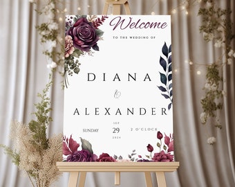 May include: Welcome to the wedding of Diana & Alexander, Sunday, September 29, 2024, at 2 o'clock.  The sign features a floral design with burgundy roses and greenery.