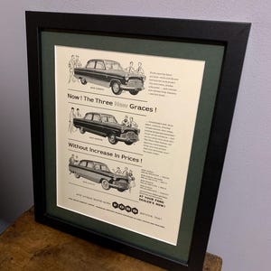 May include: A vintage black and white advertisement for Ford cars. The ad features three different Ford models, the Consul, Zephyr, and Prefect. The text reads "Now! The Three New Graces! Without Increase In Prices!" and "At Your Ford Dealer's Now!"