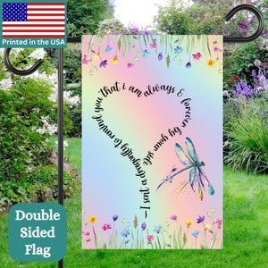 May include: A double-sided garden flag with a rainbow background and a dragonfly. The flag has the text "I sent a dragonfly to remind you that I am always & forever in your heart" written in a circle around the dragonfly.