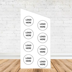 May include: White rectangular sign with eight black circles. Each circle contains the text "LOGO HERE".