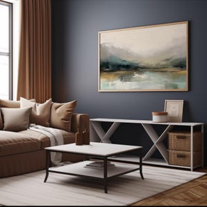 May include: A white, open-shelf console table with a wood-toned top and two woven baskets. The table is in a living room with a brown couch, a coffee table, and a large abstract painting on the wall.
