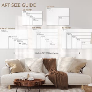 May include: A wall art size guide with different ratios and sizes for artwork. The guide shows the dimensions in inches and centimeters. The guide also shows a sofa that is 90 inches wide.
