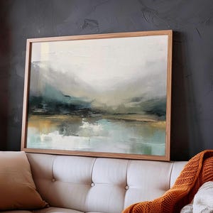May include: Abstract landscape painting in muted tones of blue, green, and brown. The painting depicts a hazy, distant scene with a body of water in the foreground.
