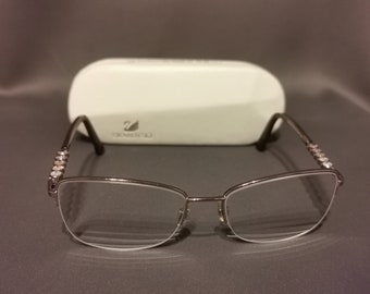 Eyeglasses frame Swarovski SK5140 Felicia. Elegant golden metal frame with crystals Swarovski.