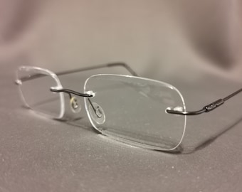 Leesbril zonder rand + 2,25, persoonlijke optiek lichtgewicht metaal, nieuw met etui, zilver