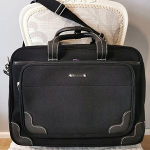 Paul Smith Zwarte canvas reistas voor heren met leren bekleding. Laptoptas voor koffer. Herenaktetas Paul Smith.
