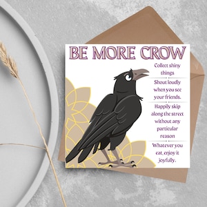 May include: Greeting card featuring a black crow illustration and the text "BE MORE CROW". The card includes instructions such as "Collect shiny things" and "Shout loudly when you see your friends."