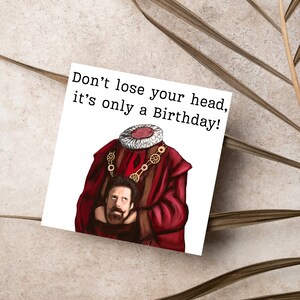 image of a square birthday card with the text 'don't lose your head, it's only a birthday' above an illustrated picture of headless Humphrey from the tv show ghosts in his red period clothing holding his head looking up at his body