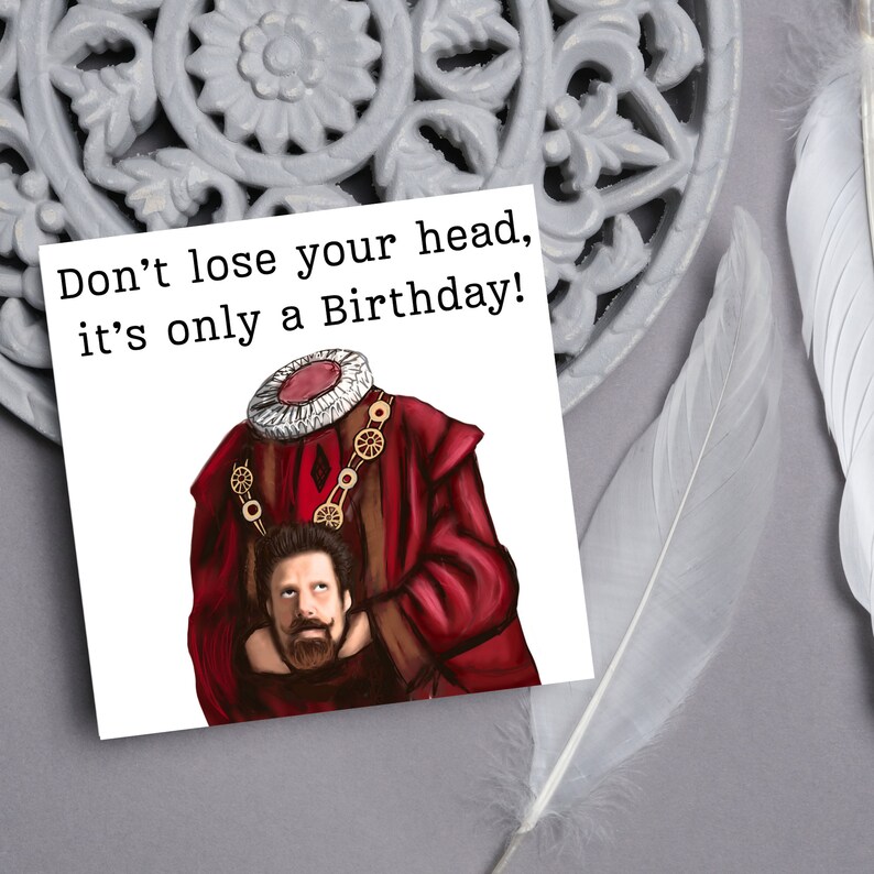 image of a square birthday card with the text 'don't lose your head, it's only a birthday' above an illustrated picture of headless Humphrey from the tv show ghosts in his red period clothing holding his head looking up at his body