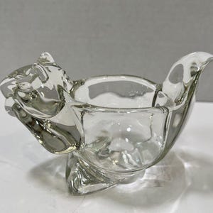 May include: A set of three ceramic mugs with a speckled, matte finish. The mugs are in shades of blue, green, and white. Each mug has a simple, modern design, perfect for coffee or tea.