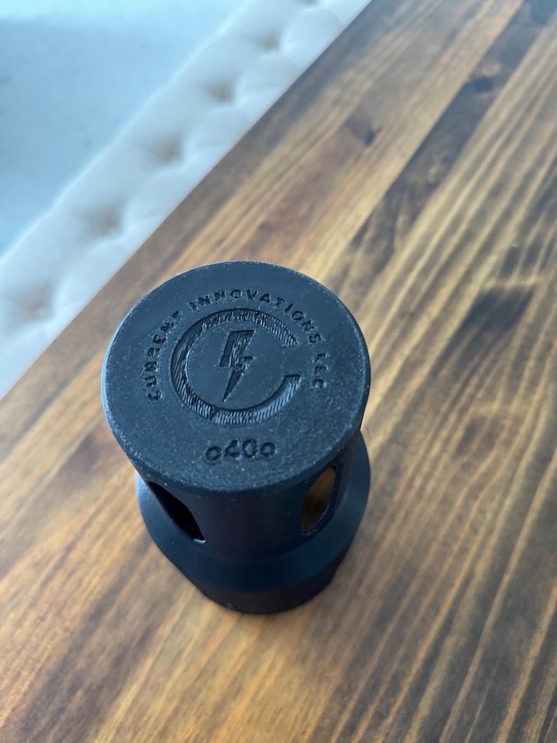 May include: Black plastic bottle cap with the text "Gumpert Innovations LLC" and a lightning bolt logo. The number "0400" is printed on the bottom.
