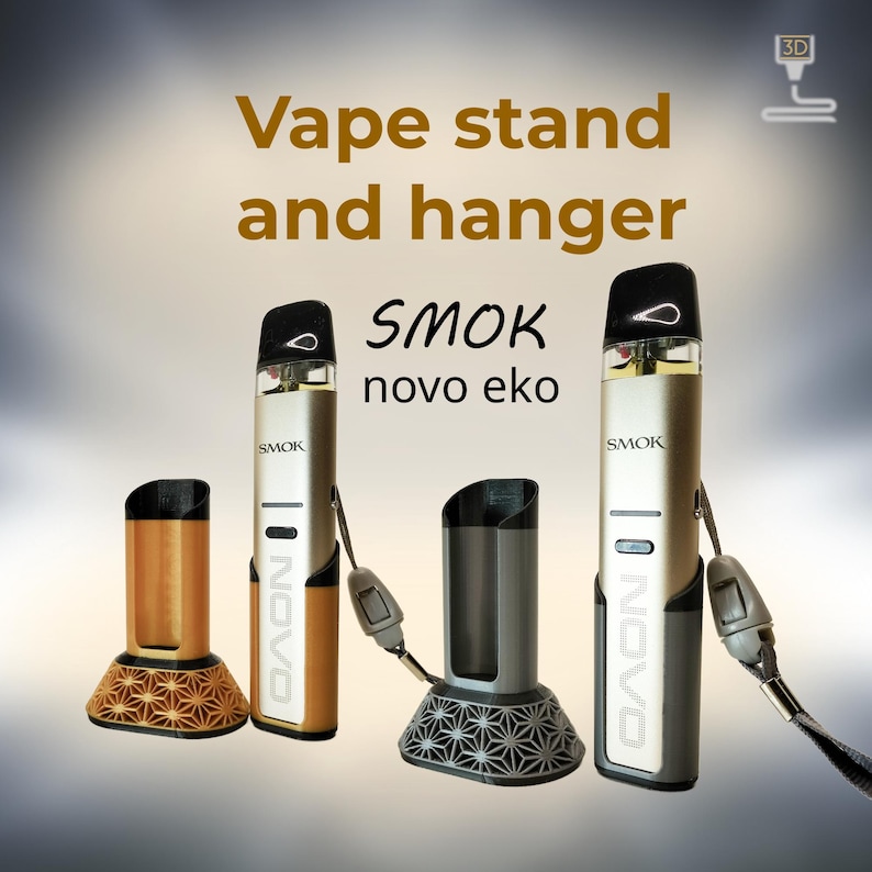 Peut inclure: Image d'un support et d'un support pour vape. L'image montre un stylo vape dor&eacute; et argent&eacute; avec un embout buccal noir et deux supports. Un support est dor&eacute; avec un motif g&eacute;om&eacute;trique, et l'autre est gris avec un motif similaire. Le texte "SMOK novo eko" est visible.