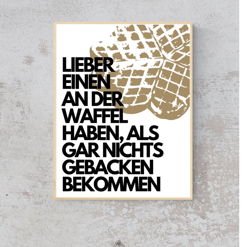 May include: A white poster with a black and white text overlay that reads "Lieber einen an der Waffel haben, als gar nichts gebacken bekommen". The background of the poster features a brown waffle graphic.