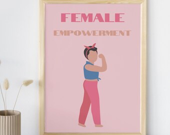 May include: A framed print with the words "FEMALE EMPOWERMENT" in pink and tan. The image features a stylized illustration of a person flexing their arm, wearing a blue top, pink pants, and a red headband. The background is light pink.