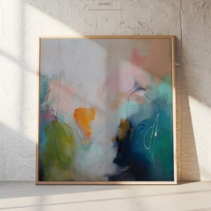 May include: Abstract art print in a wooden frame. The artwork features a blend of colors, including pink, orange, green, and blue, with black line details. The text "MUSE STUDIO" is visible at the top.