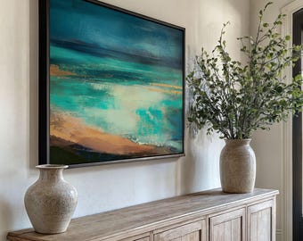 May include: An abstract landscape painting in a black frame, with blue, turquoise, and orange hues. The artwork is displayed above a wooden cabinet, complemented by two beige vases and greenery.