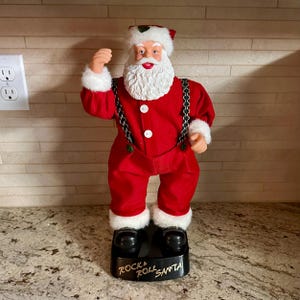Rock and Roll Hip Swinging Santa. Sings Santa Clause is Coming to