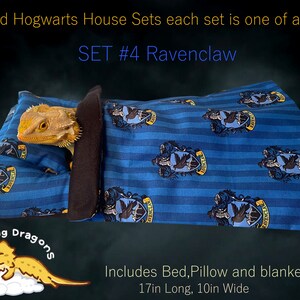 May include: A blue and gold Ravenclaw-themed bed, pillow, and blanket set for a small pet. The set features the Ravenclaw house crest and is 17 inches long and 10 inches wide.