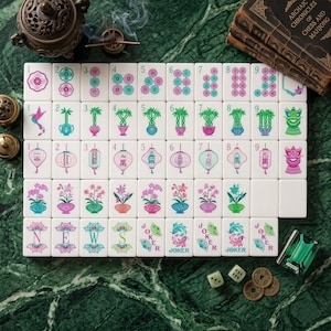 May include: A set of white Mahjong tiles featuring colorful illustrations of flowers, bamboo, lanterns, and dragons. The tiles include numbered suits, directional markers labeled N, E, W, S, and Joker tiles with fan graphics, arranged in a grid pattern.