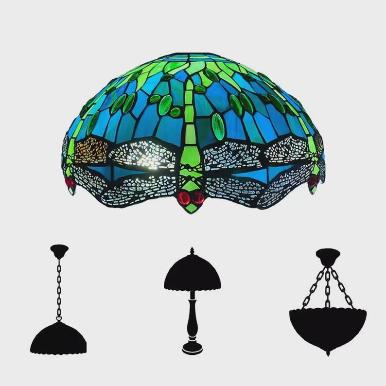 May include: A stained glass dragonfly lamp shade in shades of blue and green. The lamp shade is a dome shape with a dragonfly design. Silhouettes of a pendant lamp, table lamp, and chandelier are below.