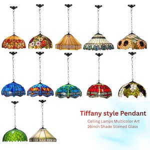 May include: A collection of Tiffany-style pendant ceiling lamps with 16-inch stained glass shades. The lamps feature various colorful designs, including floral, dragonfly, and geometric patterns. Each lamp hangs from a black chain.