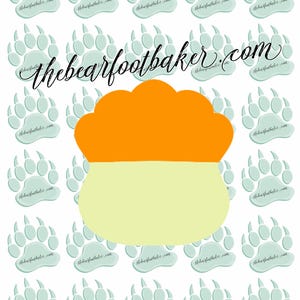 May include: A digital illustration with a repeating pattern of light blue bear paw prints, each with the text "thebearfootbaker.com". A two-tone shape, orange above and light yellow below, is centrally positioned.