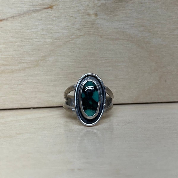 Sterling Silver turquoise Ring. Size 7. Handmade with a blue turquoise oval stone. This ring is one of a kind with a thick split band.