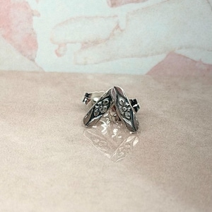 Sterling silver studs pair with a floral design• Solid silver handmade earrings for everyday wear•