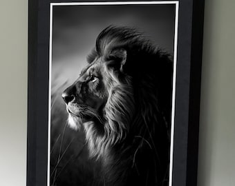 May include: A black and white photograph of a lion's head and mane. The lion is looking to the right, with its mane blowing in the wind. The background is blurred and out of focus.