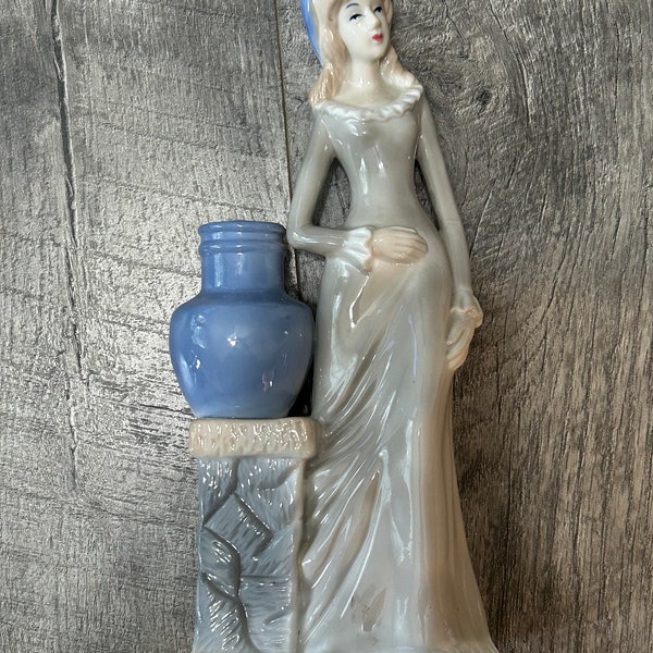 Vintage Ceramic Women with small Vase- blue and white- holding stomach- retro ceramic - blue , bottom has  crack, see photos