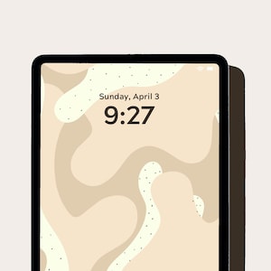 May include: A tablet screen with a beige abstract background and black text that reads "Sunday, April 3 9:27 Press home to unlock". The text "RANCH" is printed in white below the tablet.