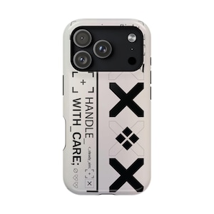 May include: A white smartphone case featuring a black graphic design. The text reads HANDLE WITH CARE, steady_aim, and includes three large black X symbols, a diamond pattern, and various geometric line markings across the back surface.