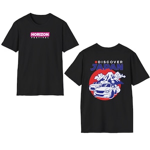 May include: A black short-sleeve t-shirt featuring the text HORIZON FESTIVAL on the front. The back displays a graphic of two cars drifting in front of Mount Fuji with the text DISCOVER JAPAN set against a large red circle background.