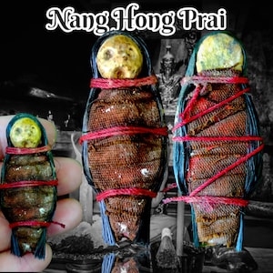 May include: Three small, brown, cloth-wrapped figures with red string tied around them. The figures have a yellow-brown head and black hair. The text "Nang Hong Prai" is written in white at the top of the image.