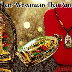 May include: A gold and red Thai amulet pendant featuring a deity holding a sword, displayed on a red velvet stand and a wooden beaded necklace.