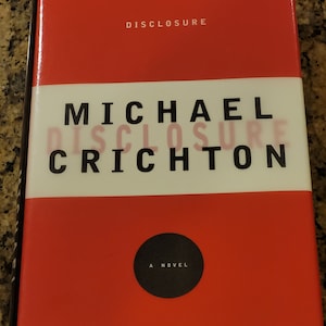 Michael Crichton&#39;s novel Disclosure.  Vintage First Edition. Hard cover book in good condition.