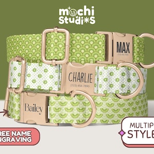 May include: Three personalized dog collars with gold-colored hardware. The collars feature a kiwi fruit pattern and are engraved with names and phone numbers. The collars are in different styles and are displayed on a green background. The brand name "mochi Studi*s" is at the top.