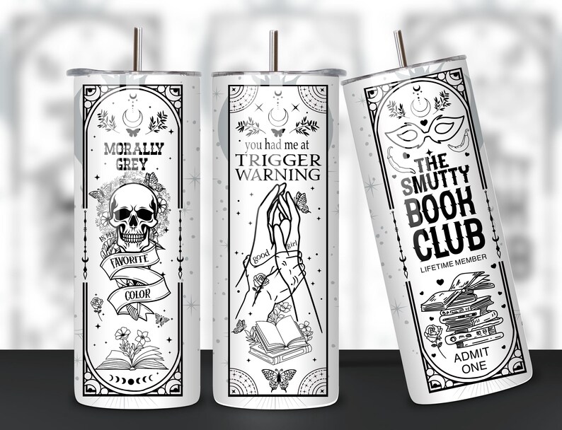 May include: Three white tumblers with black designs. The first tumbler says "Morally Grey" with a skull and crossbones and the text "My Favorite Color". The second tumbler says "You had me at Trigger Warning" with a pair of hands holding a book. The third tumbler says "The Smutty Book Club" with a mask and a stack of books.