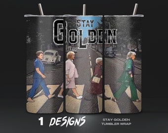 May include: A tumbler wrap design featuring four women walking across a crosswalk, with the text "Stay Golden" above them. The design is inspired by the iconic Beatles album cover.