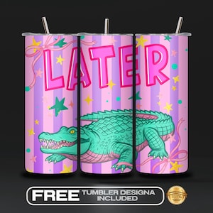 May include: A pink and purple tumbler with the word "LATER" in pink letters. The tumbler features a cartoon alligator in green and pink, with stars and ribbons. The tumbler includes a silver straw.