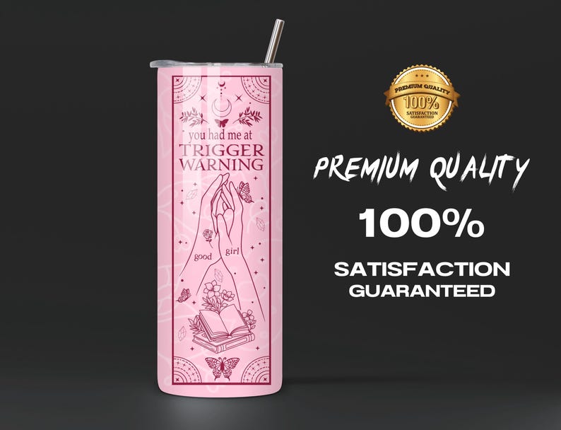 May include: Pink stainless steel tumbler with a design of two hands holding a book and the text "you had me at trigger warning" with butterflies and flowers.