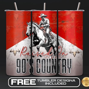 May include: A stainless steel tumbler with a cowboy riding a horse graphic. The tumbler has a red and white background with the text "Raised On 90's Country". Includes a straw and the text "FREE TUMBLER DESIGNA INCLUDED".