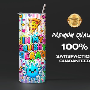 May include: A cylindrical tumbler with a metal straw featuring a colorful design of a smiling pizza slice and a blue splash character. The text reads IN MY SQUISHY ERA against a background of vertical stripes, hearts, stars, and paint splatters.