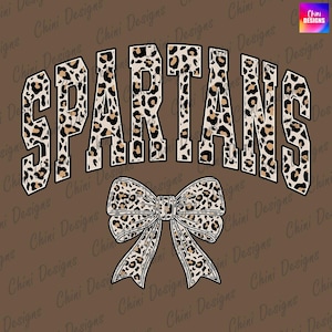 May include: Brown graphic design featuring the word "SPARTANS" in a leopard print font, arched across the top. A leopard print bow is centered below the word. The background is a solid brown color.