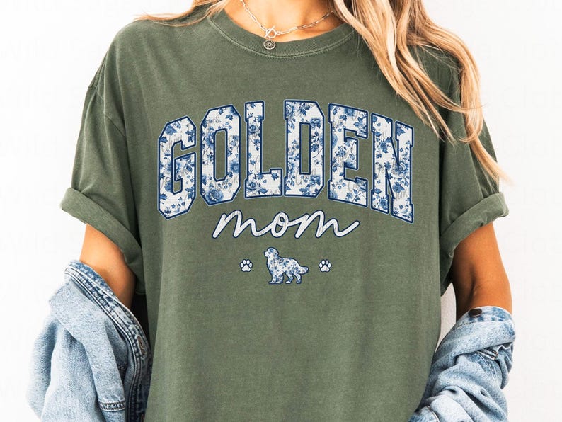 a woman wearing a green shirt that says golden mom