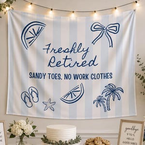 May include: A retirement party scene with a banner that reads "Freshly Retired." The banner has blue stripes and beach-themed illustrations. A table is set with a cake, cookies, and framed signs. Balloons and flowers decorate the background.
