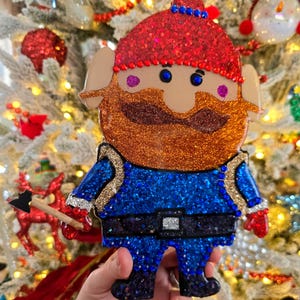 Yukon Cornelius Wall Art With Glitters, gems and ax with epoxy resin finishing, Rudolph gifts, Misfit toys, Yukon Corneilus Ornament