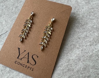Earrings in a leaf design with stones, gold-colored, olive leaves, beautiful for a wedding